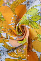 Tissu fleuri orangé pour kit couture Pauline personnalisable.